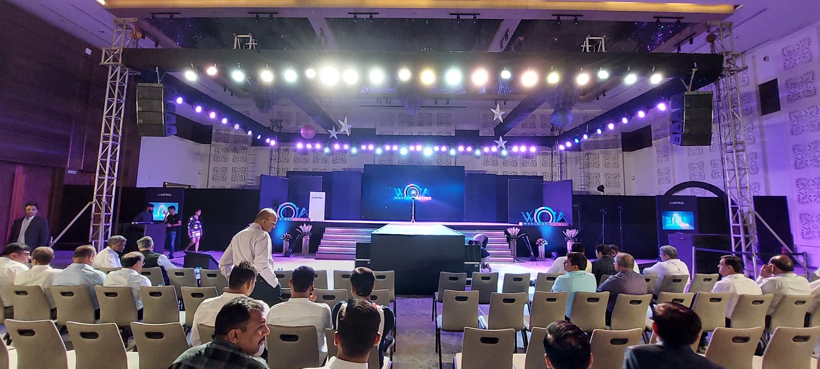 Astral World of Astral event stage with festoon lights, moving heads and central LED