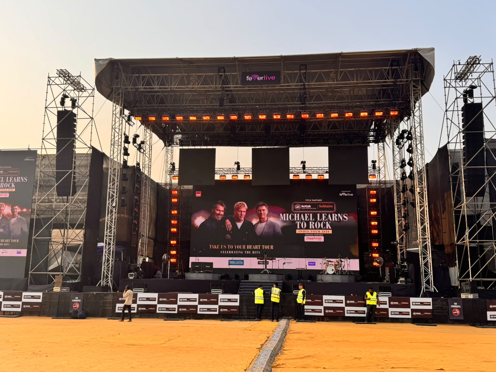 Michael Learns to Rock India Tour 2026 main stage with Kotak Solitaire branding and Feverlive production