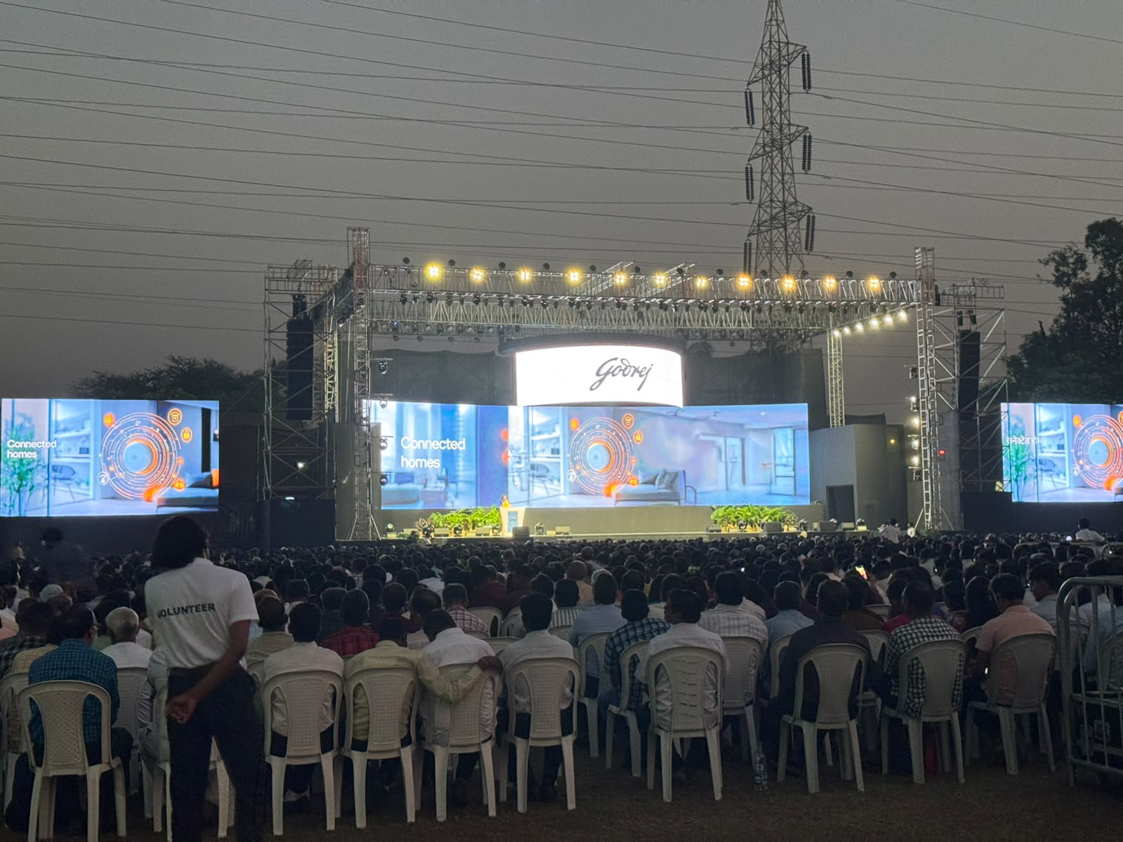 Godrej Connected Homes outdoor product event with massive seated crowd and triple LED walls