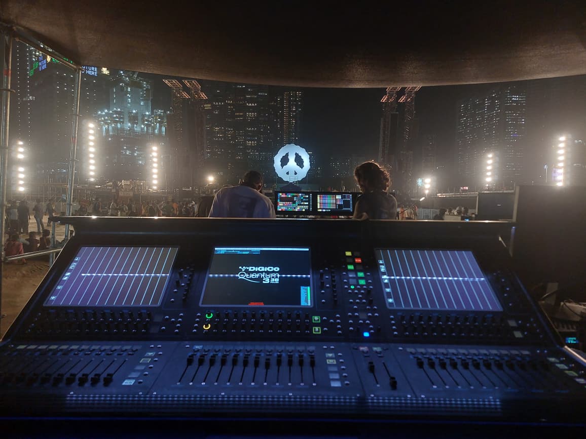 Keinemusik FOH position with DiGiCo Quantum 338 console overlooking the crowd and peace sign stage
