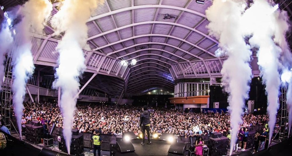 Indoor arena stage with CO2 jets and packed crowd