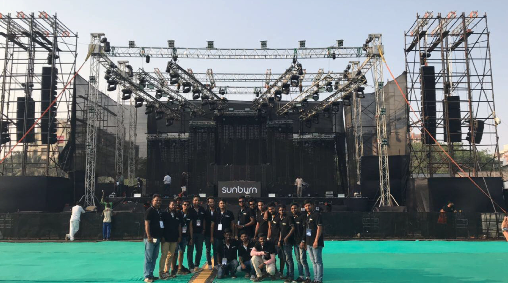NJSM crew posing in front of Sunburn festival stage